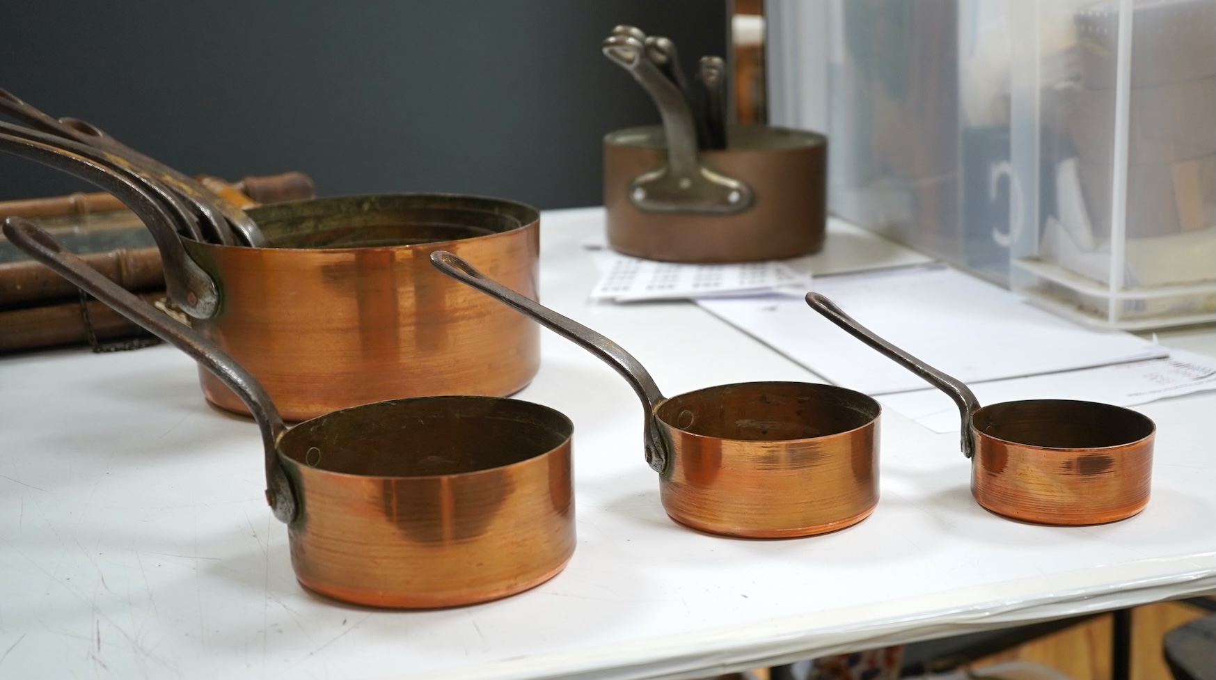 A graduated set of seven French copper pans